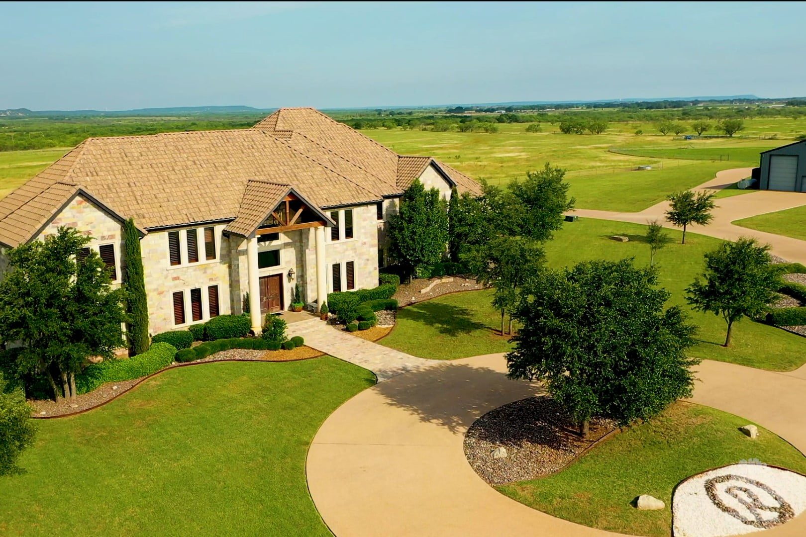 Rusted Oaks Estate from above — resort pool, baseball field, and tennis court