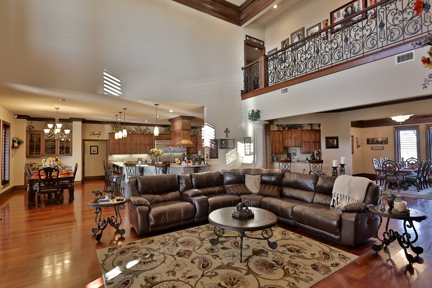 Open-concept great room, kitchen, and dining area at Rusted Oaks Estate