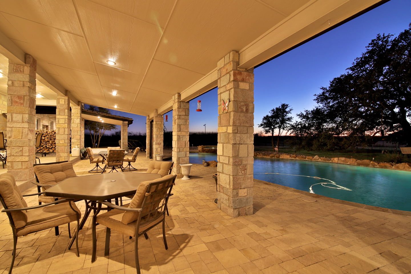 Covered patio overlooking pool at Rusted Oaks Estate