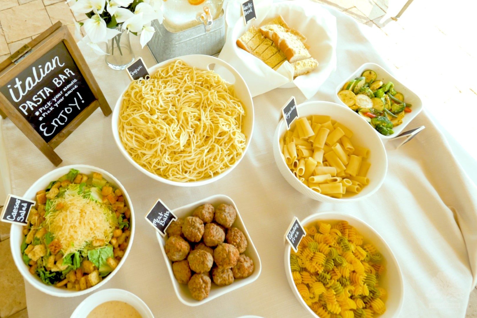 Overhead view of catered pasta bar spread at Rusted Oaks Estate event